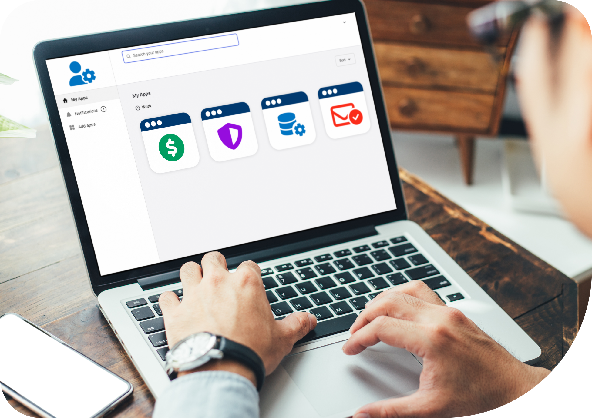 Feature-Scale-Team-RBAC A photo of a remote worker accessing only those apps and assets appropriate for their role.